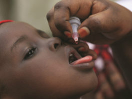A child receiving drops of the Polio vaccine