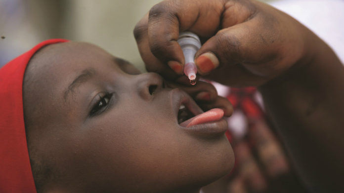 A child receiving drops of the Polio vaccine